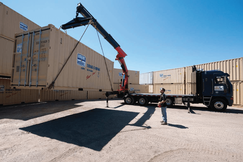 level loading shipping container onto moving truck