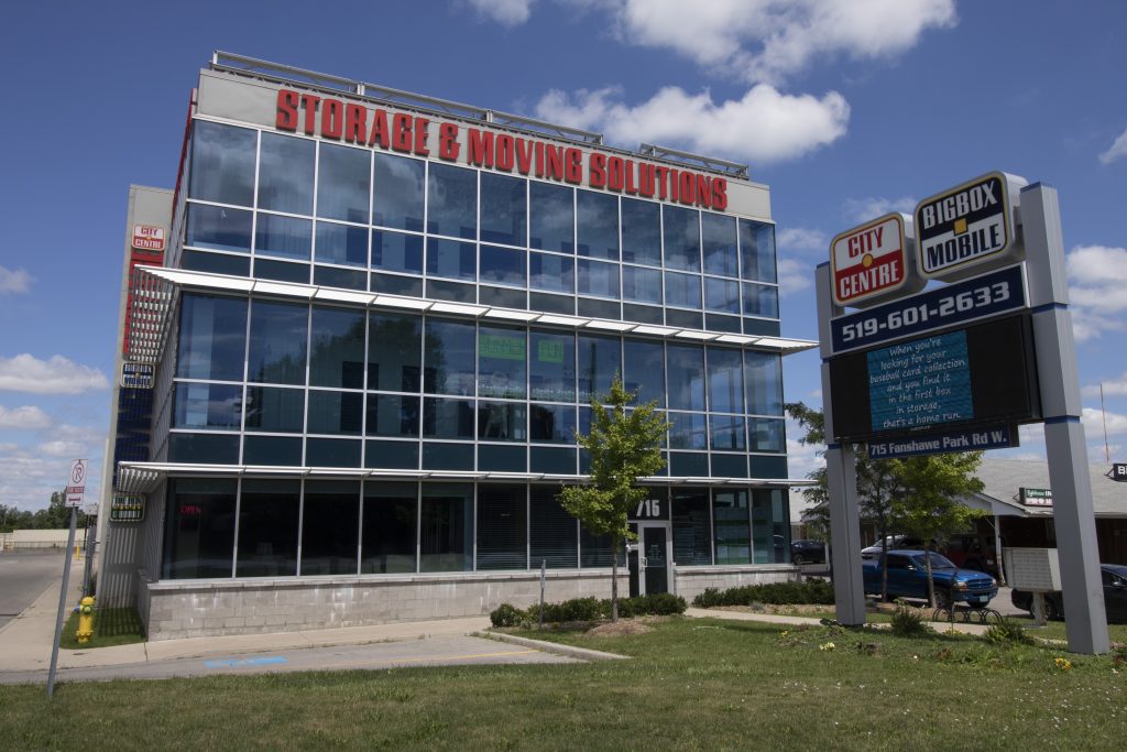North London self storage facility on Fanshawe and Wonderland with storage and moving solutions written on top of building and sign out front with city centre and big box mobile storage logo plus phone number 519-601-2633